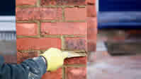 Red Brick Column of garden wall been regrouted and repaired